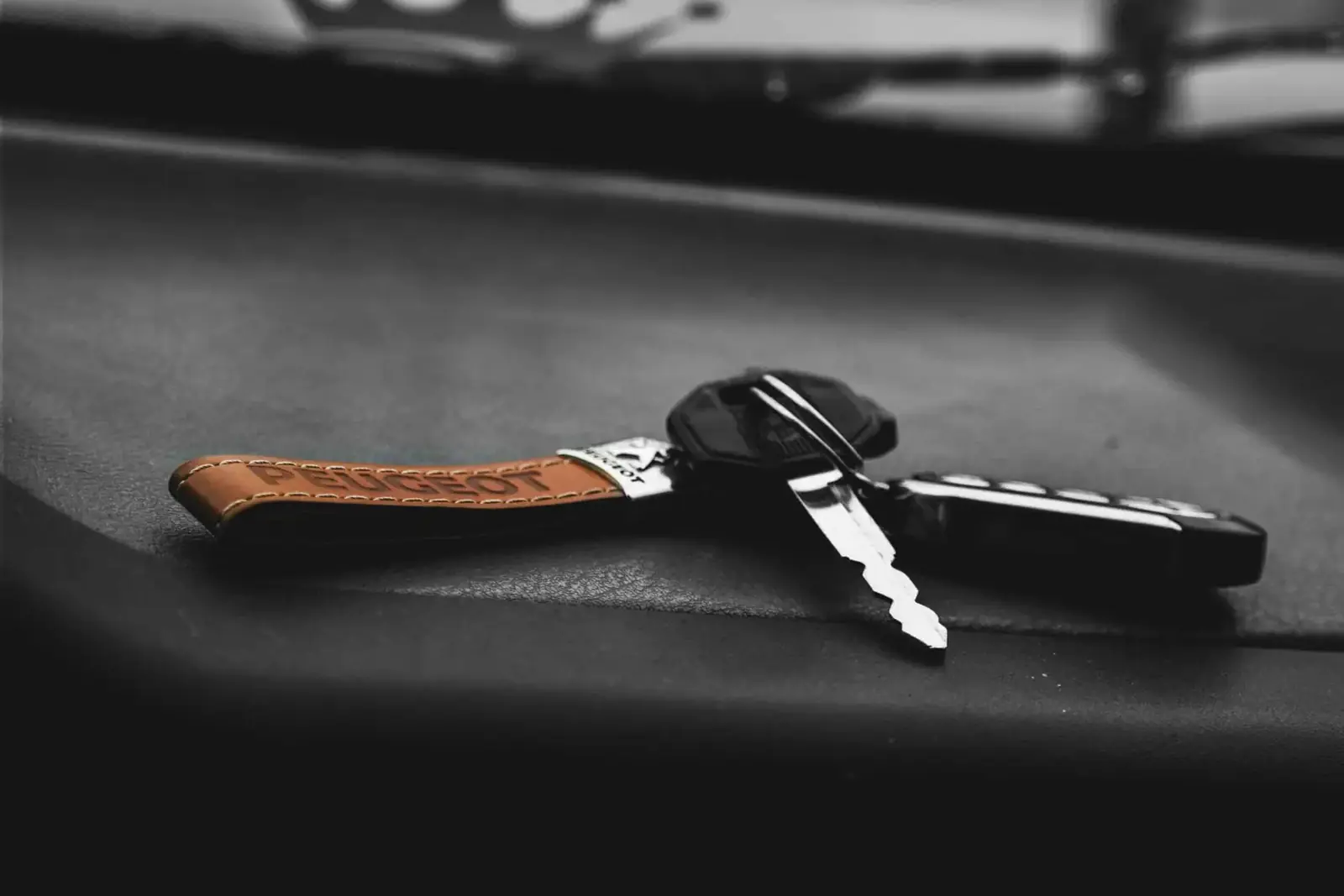 A broken car key and remote fob