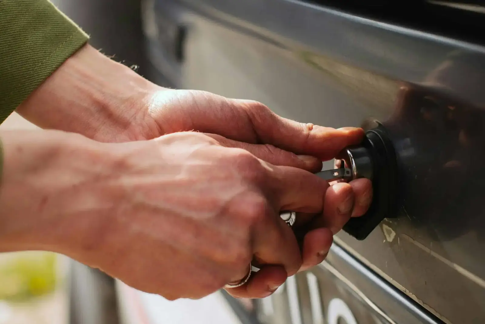 Auto locksmith working on a car door lock